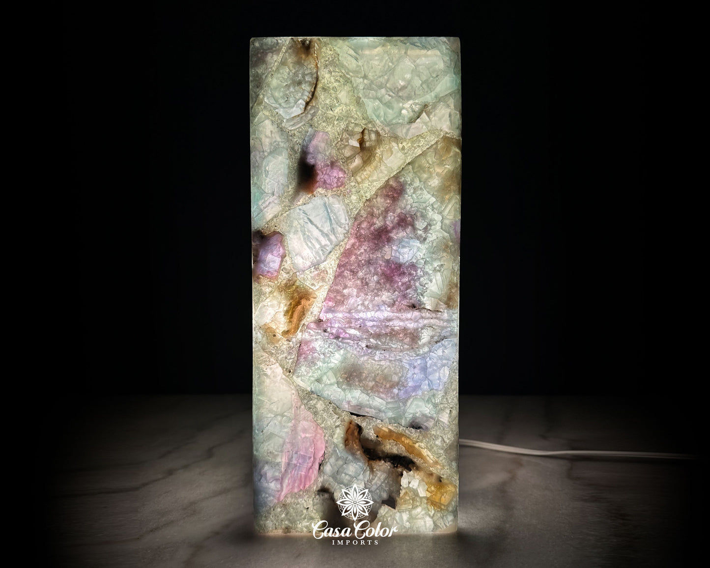 Fluorite Lamp. Translucent lamp with purple, greens, blues and unlimited colors when is on. this lamp is 14" high and 6" wide.