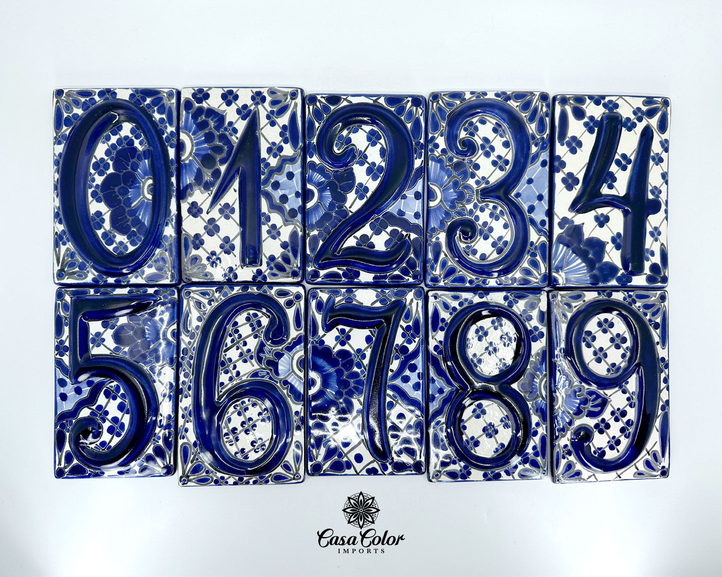 Talavera Street numbers. The color is white background with blue relief number and blue flowers. The size is approximately 5.5 " X 3.5"