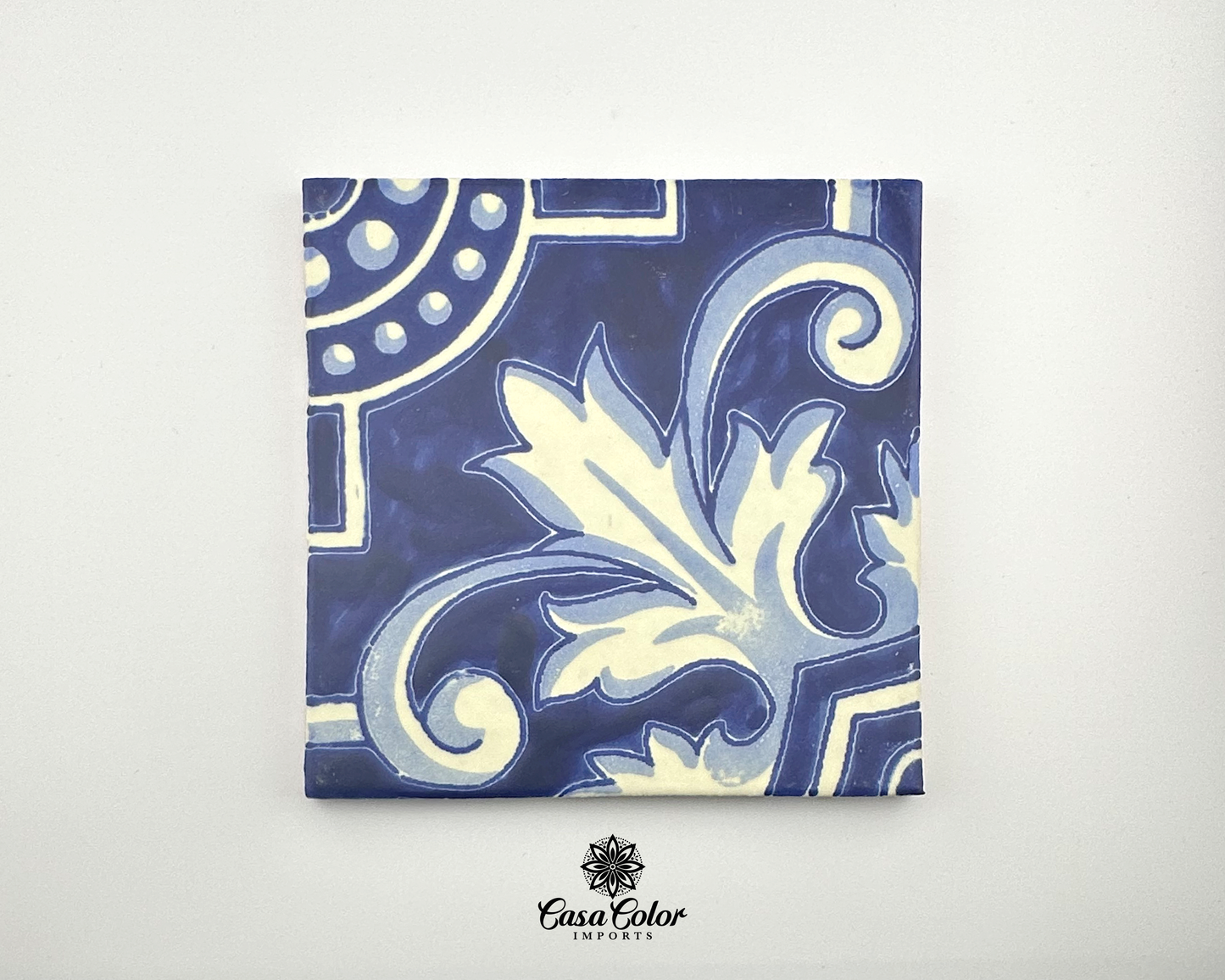 White and blue tile 6 inches by 6 inches. This is a totally hand painted tile. Multiple tiles make these big flower curvy shapes.