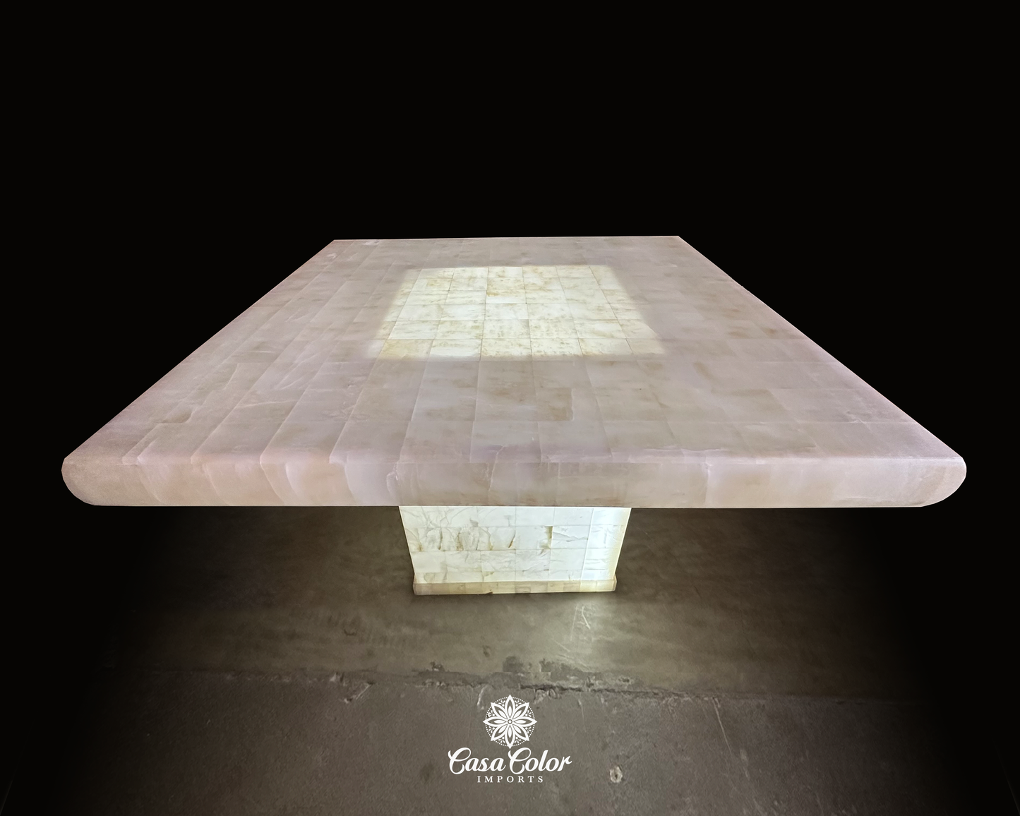 Onyx square translucent white table . The table has lighting in the center of the table coming from the based of the table. The size of the table is 51.2 inches X 51.2 inches.