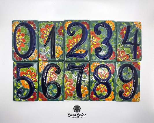 Mexican Talavera street address numbers. The tile numbers are blue painted in relief with a flower background. The size of the tiles is 3.5' wide and 5.5 high.  