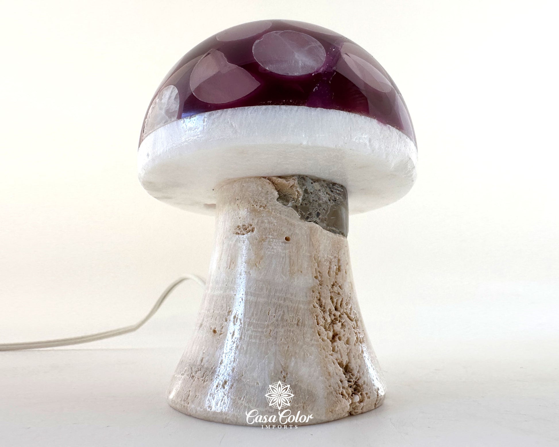 purple mushroom onyx lamp with white base. 