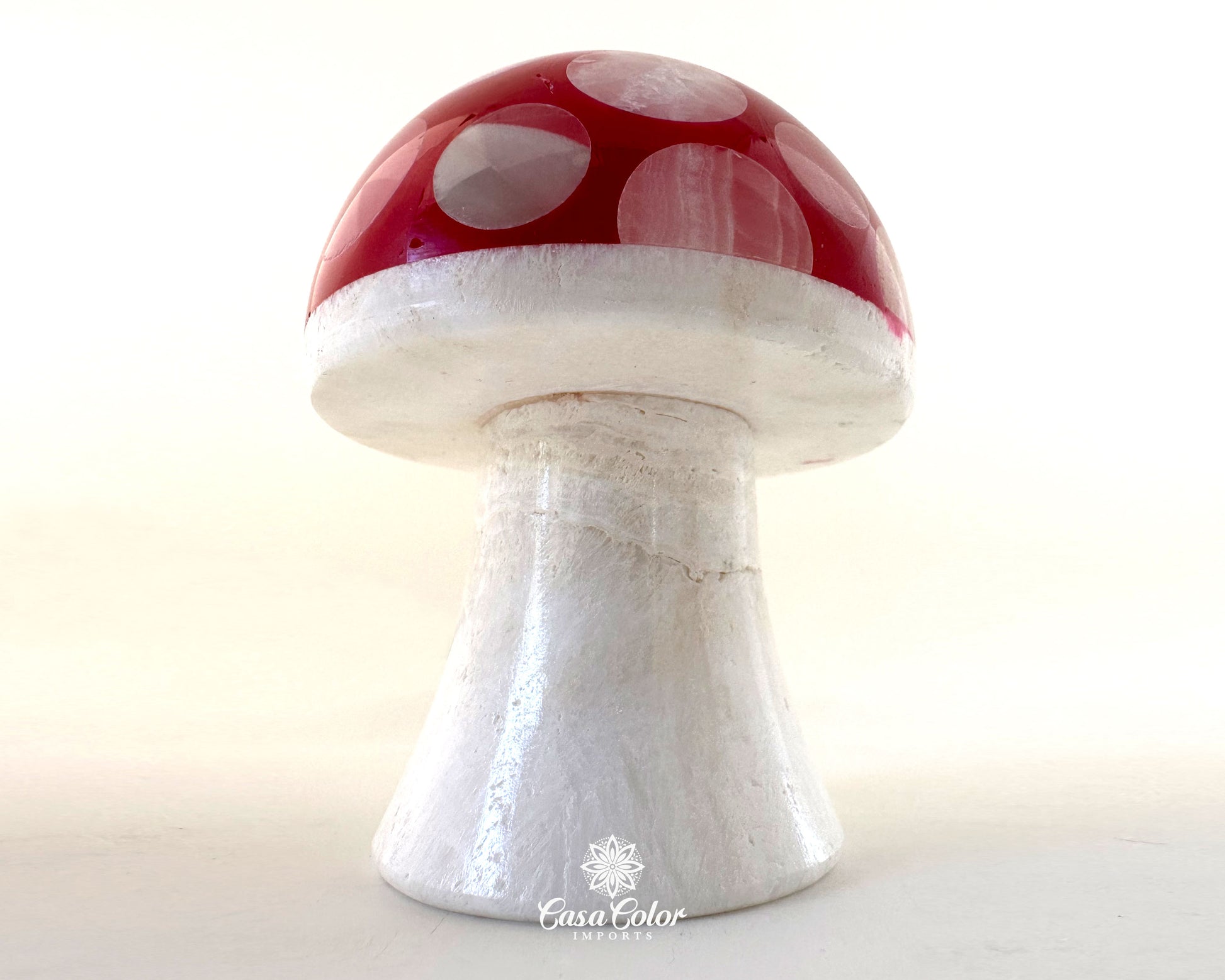 Onys red mushroom lamp with white base.