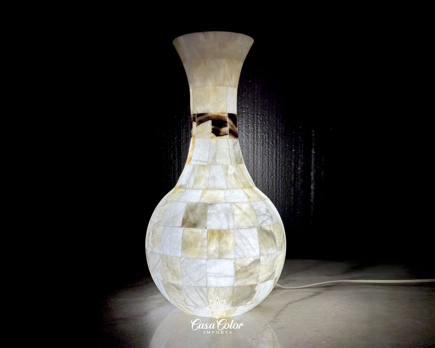 You won't find this lamp anywhere else. The lamp base is made out of Onyx stone with soft silver and brown shades.  Size:  21.5 in. Height x 6.5 in. Width (Top) x 11.5 in. Width (Base)