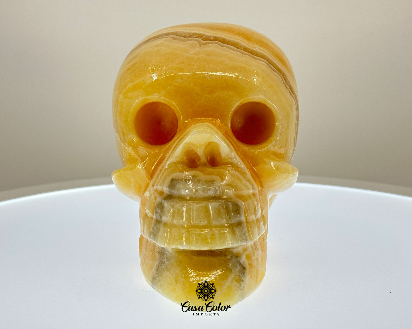 Glossy Orange and White Calcite Onyx Hand Carved Realistic Skull - 6.25"