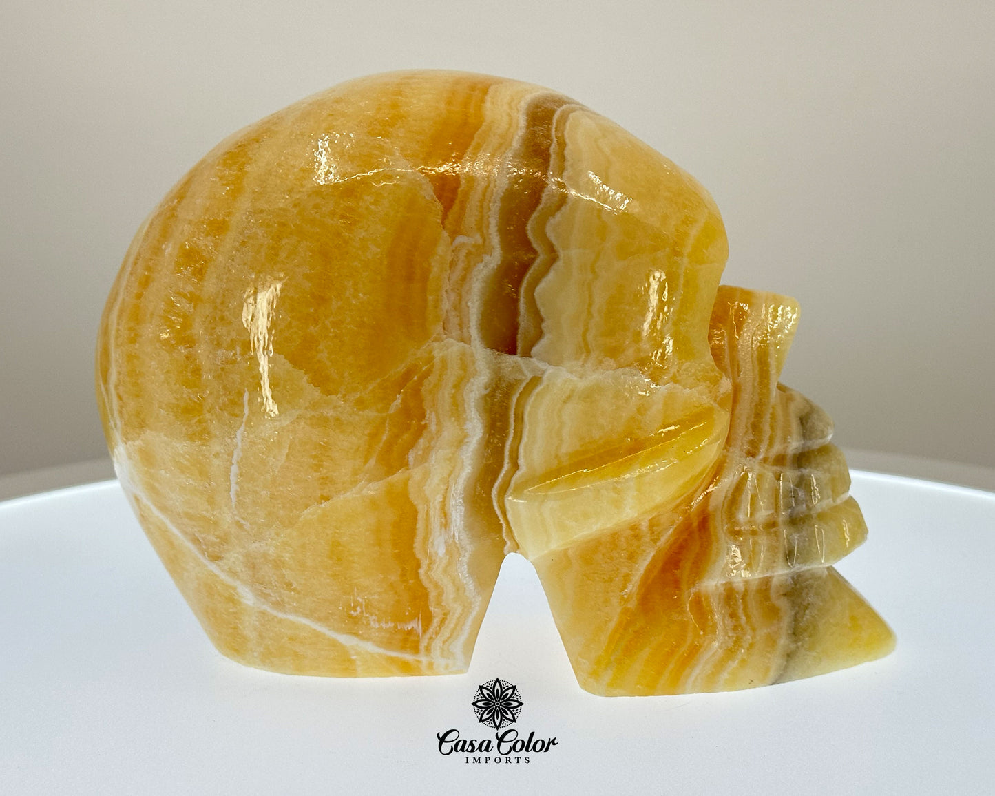 Glossy Orange and White Calcite Onyx Hand Carved Realistic Skull - 6.25"