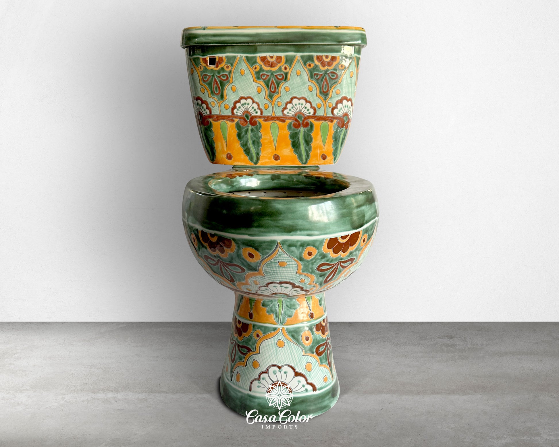 Elongated Talavera Toilet with flower design. The main colors are Green and Orange.