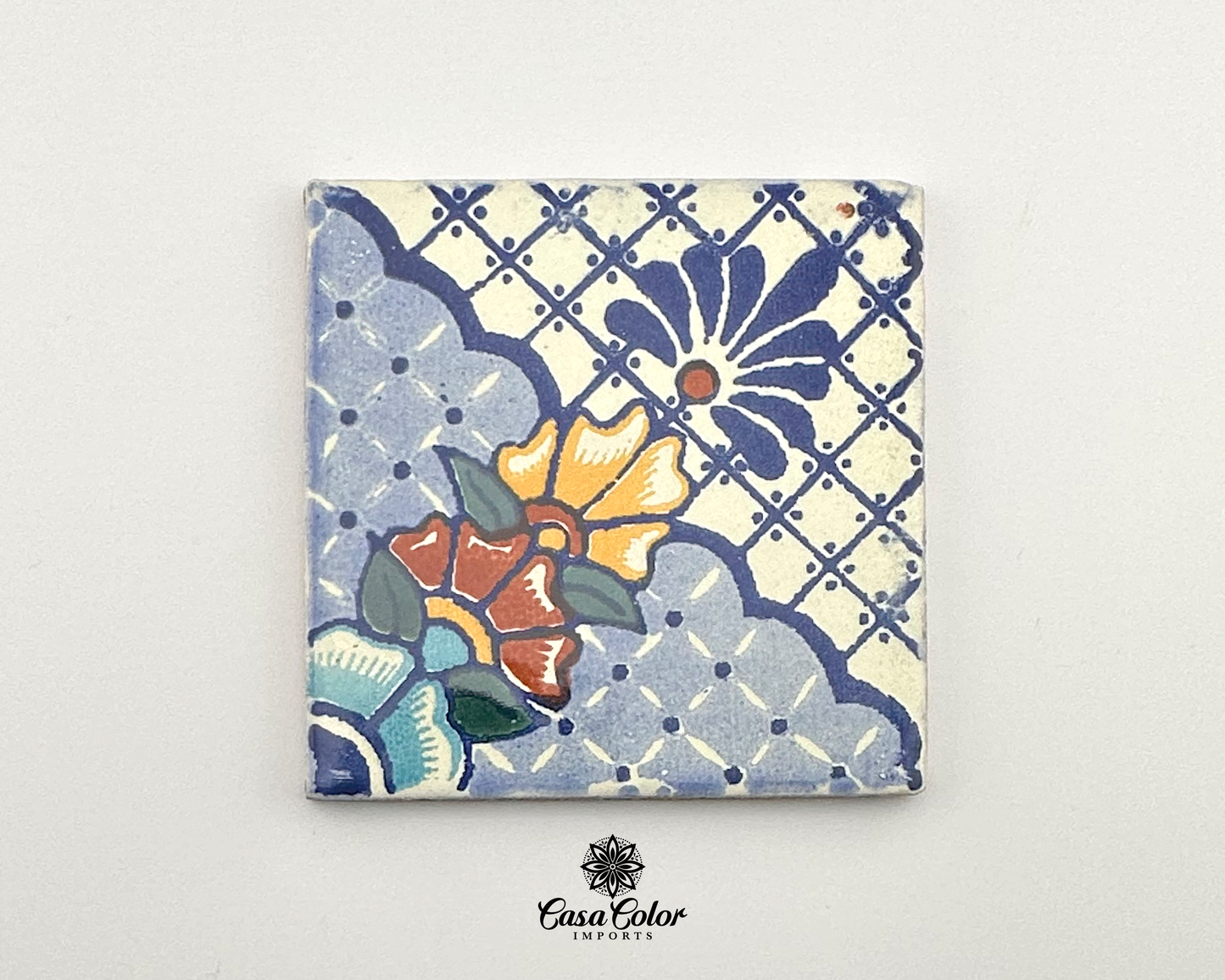 Mexican Talavera Tile, blue, white with yellow flower. Size is 4 by 4 inches.