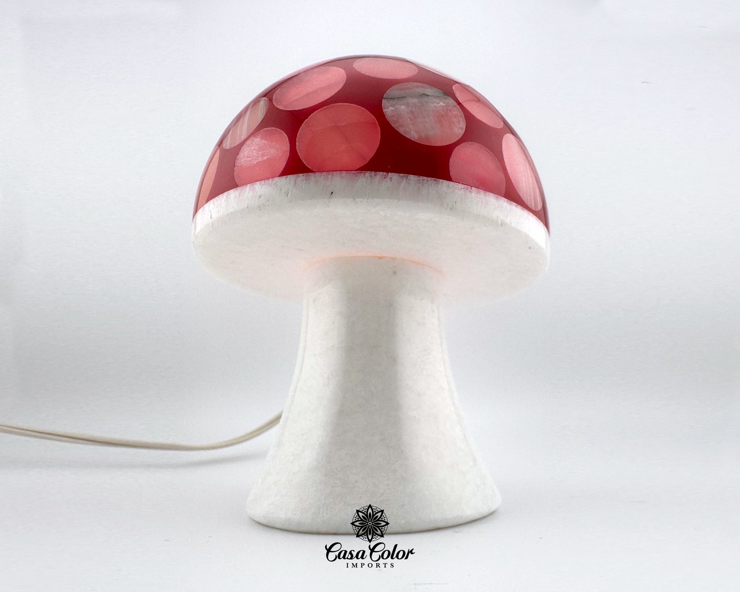 Onyx mushroom lamp. The color is pink/reddish. The size is 6 inch high and 4 inch diameter. The steam is white and the top is pink/reddish.. 